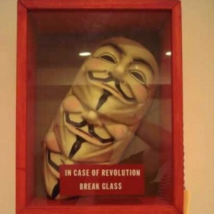 Break Glass artwork with V for Vendetta masks inside Radio Clash 31: Aural pOddities (or the Annual Aural Terrorist Pledge Drive) mashup music eclectic podcast cover