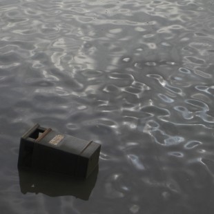 RC 206: Wise Enough? eclectic music mashup podcast cover is a cast iron litter bin the River Thames at Hammersmith