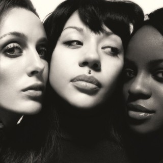 Reformed Sugababes lay down in a Swimming Pool